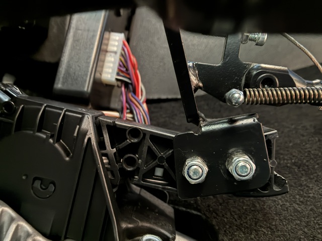 Completed left-foot accelerator setup allowing adapted and standard driving modes