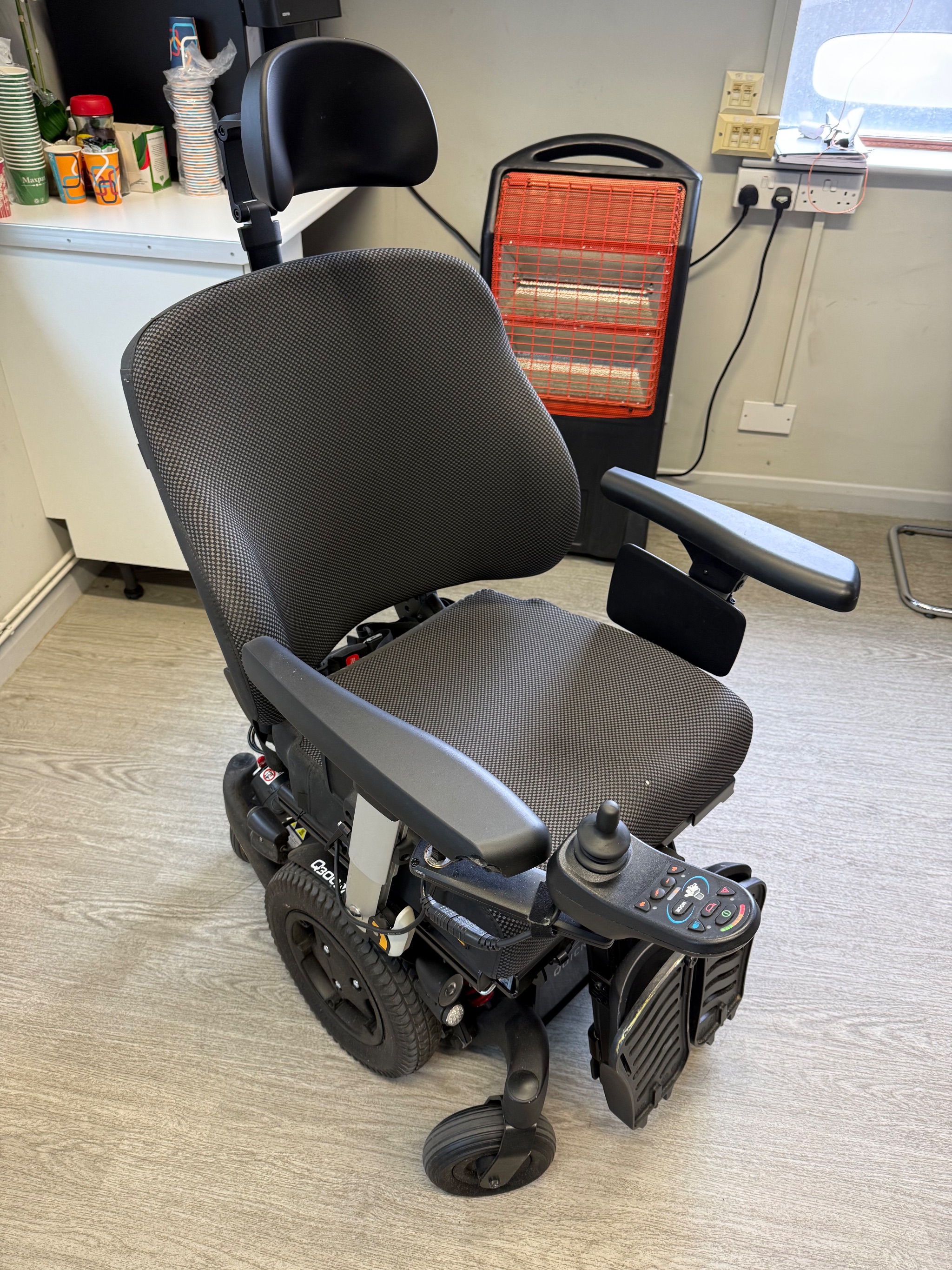 Quickie Q300 M Mini powerchair undergoing battery testing at our workshop