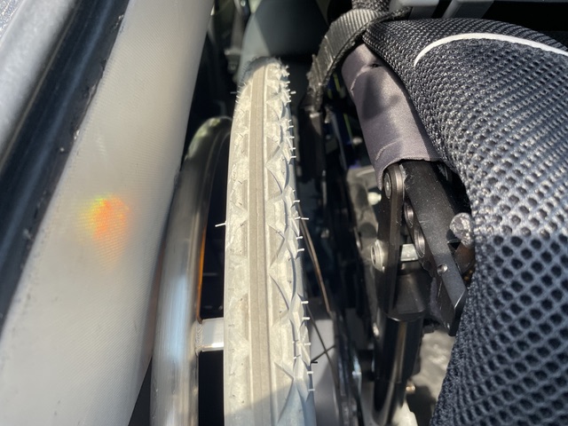 Mobility device attached to boot hoist bracket in the boot of a Honda HR-V