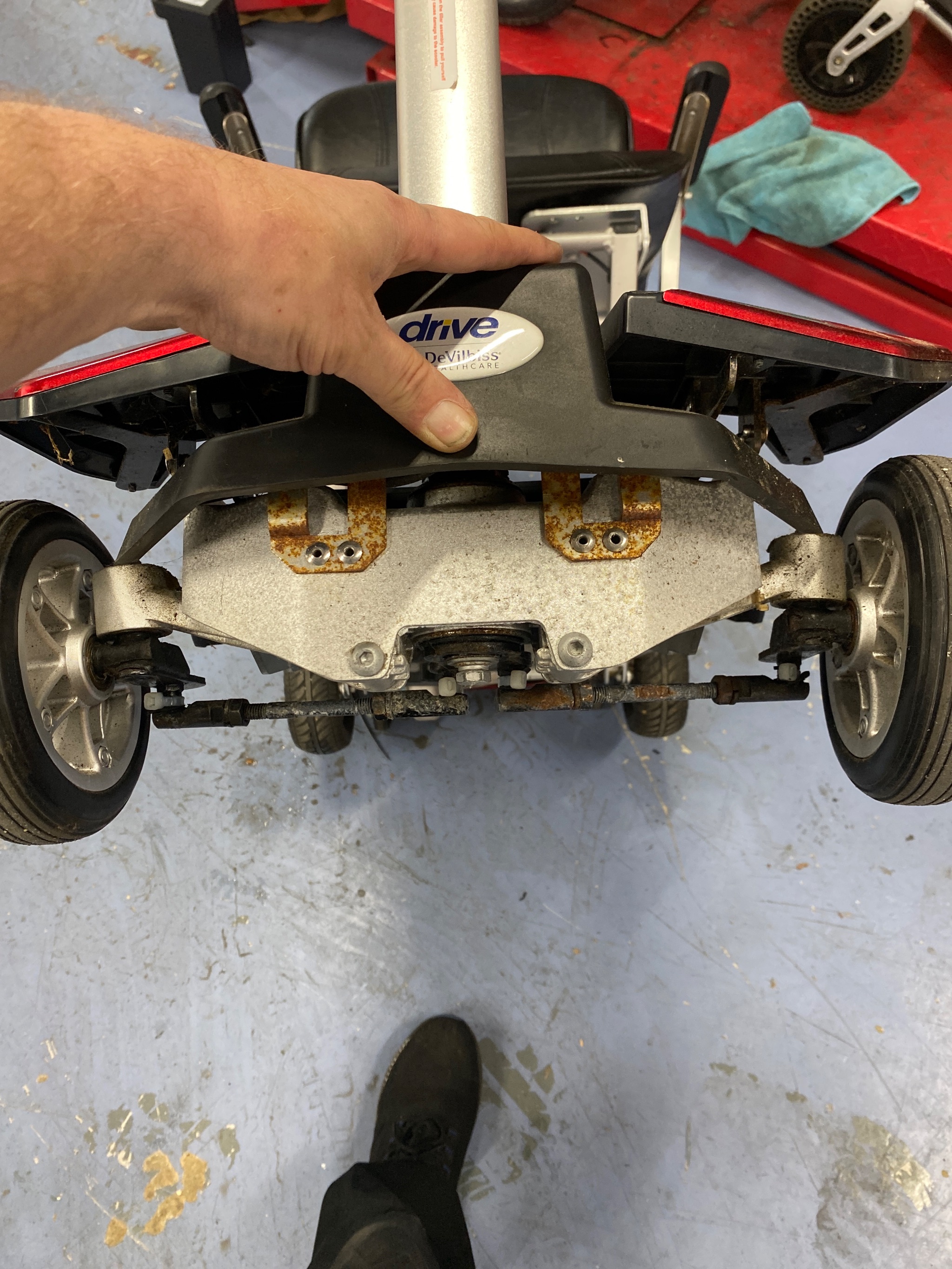Rear wheel rim inspection and maintenance during scooter service