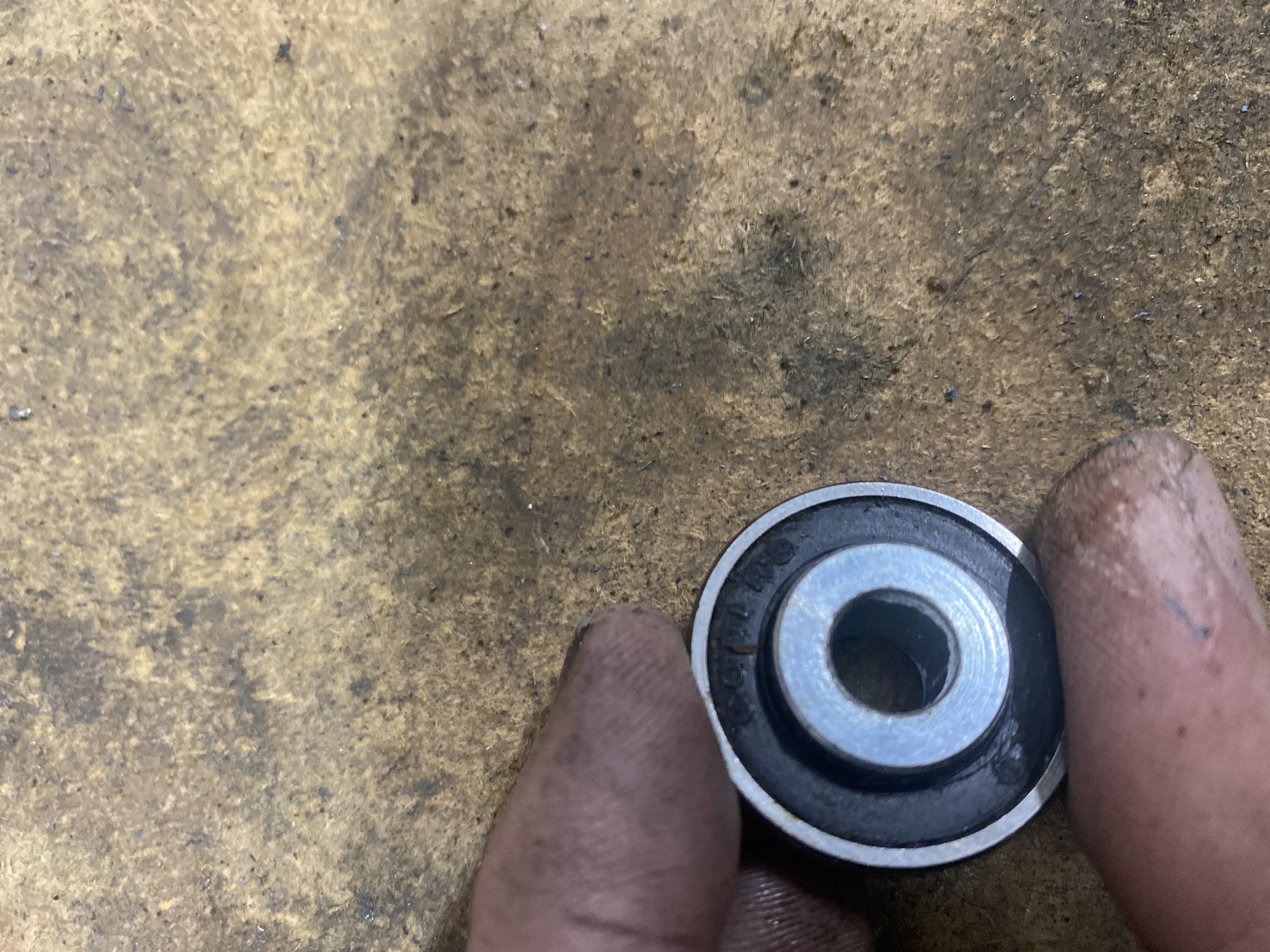 Technician fitting replacement solid tyres on a powerchair drive wheel