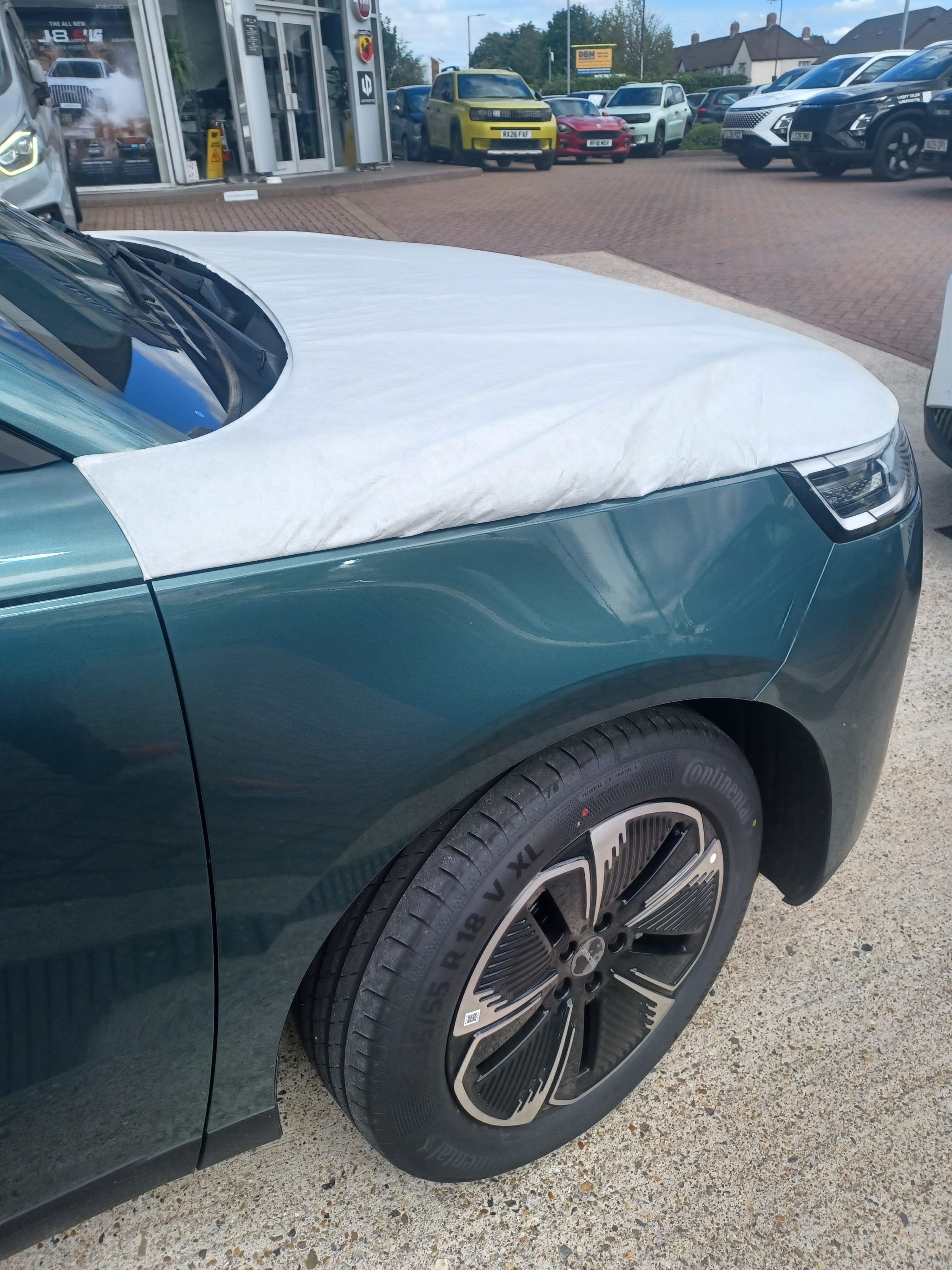 Installer testing the driving control adaptations inside the car cabin