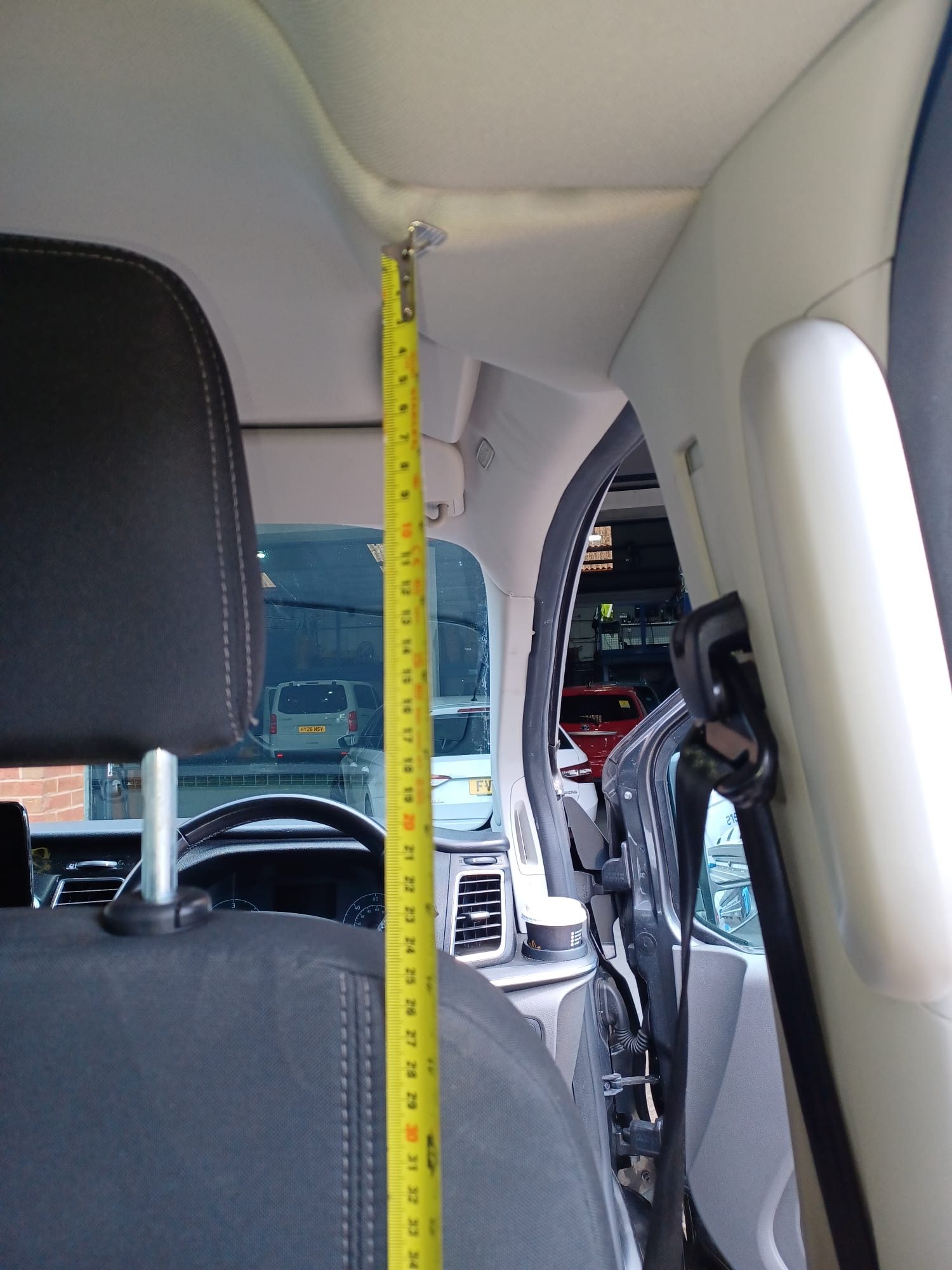 Protective cabin screen installed behind front seats in a Ford Tourneo Custom