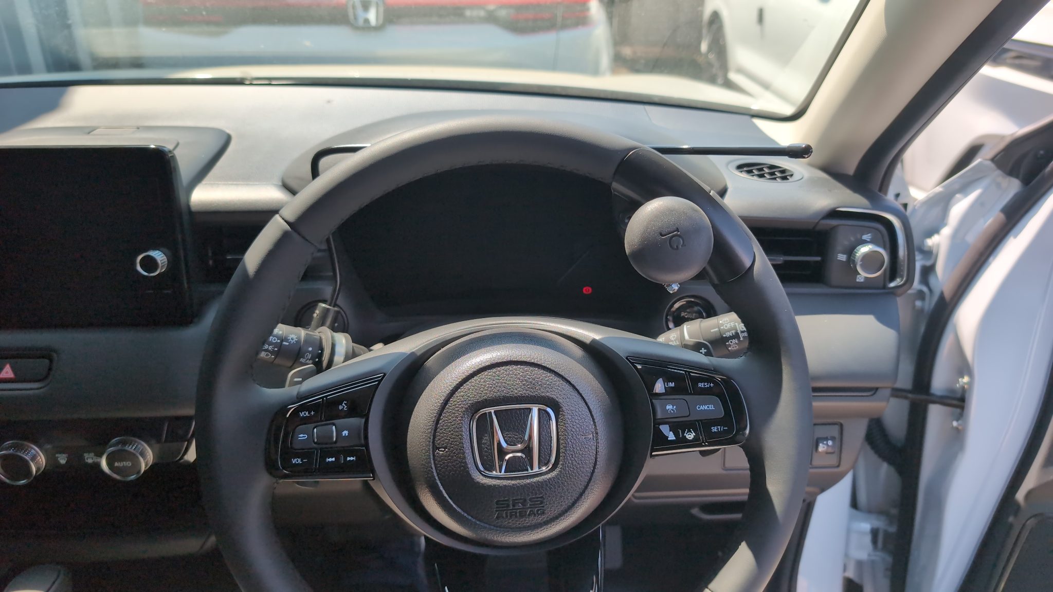 Jeff Gosling quick-release steering ball mounted on a Honda HR-V steering wheel