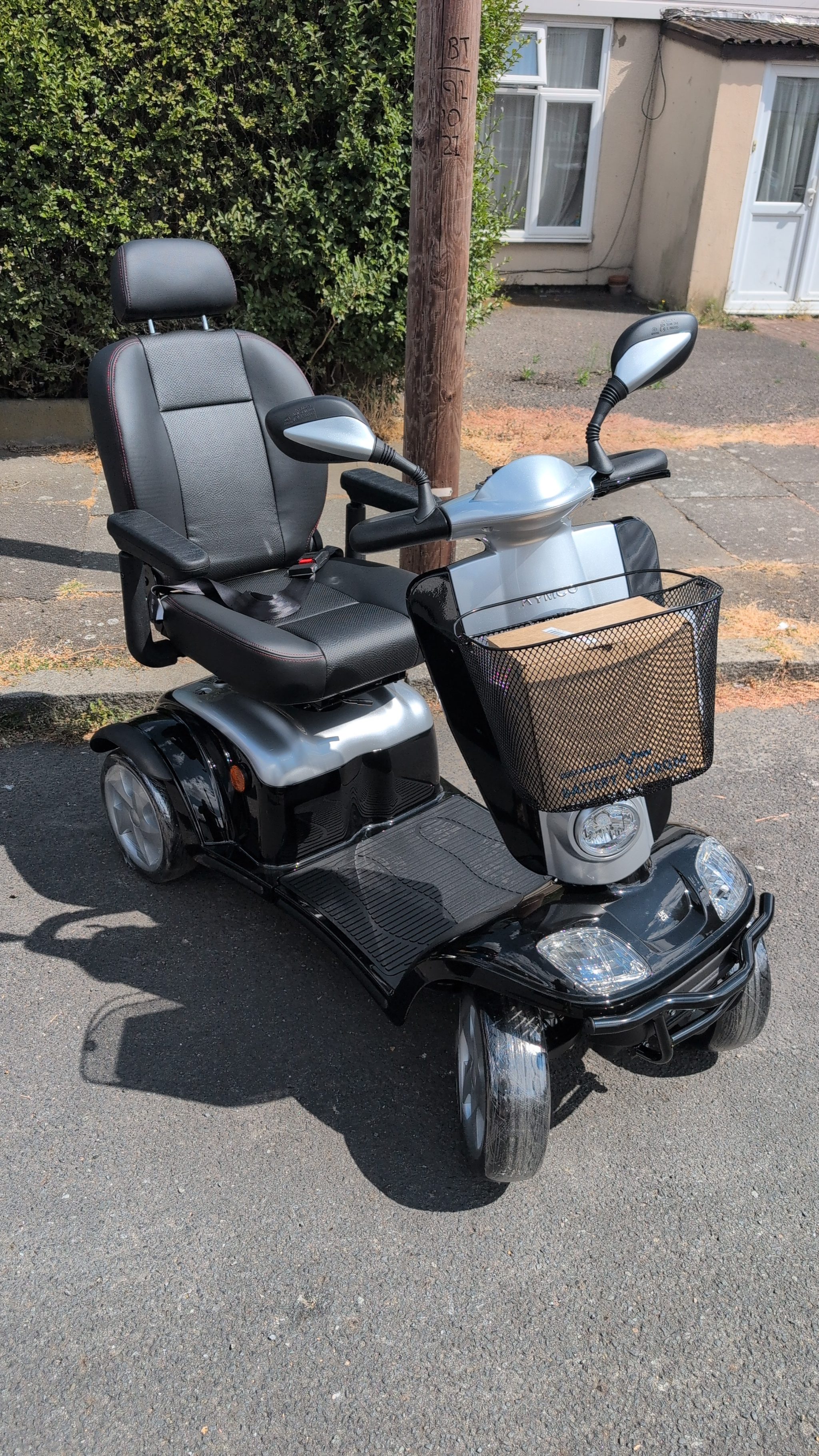 Close up of the front headlight and indicators on a road legal Kymco scooter
