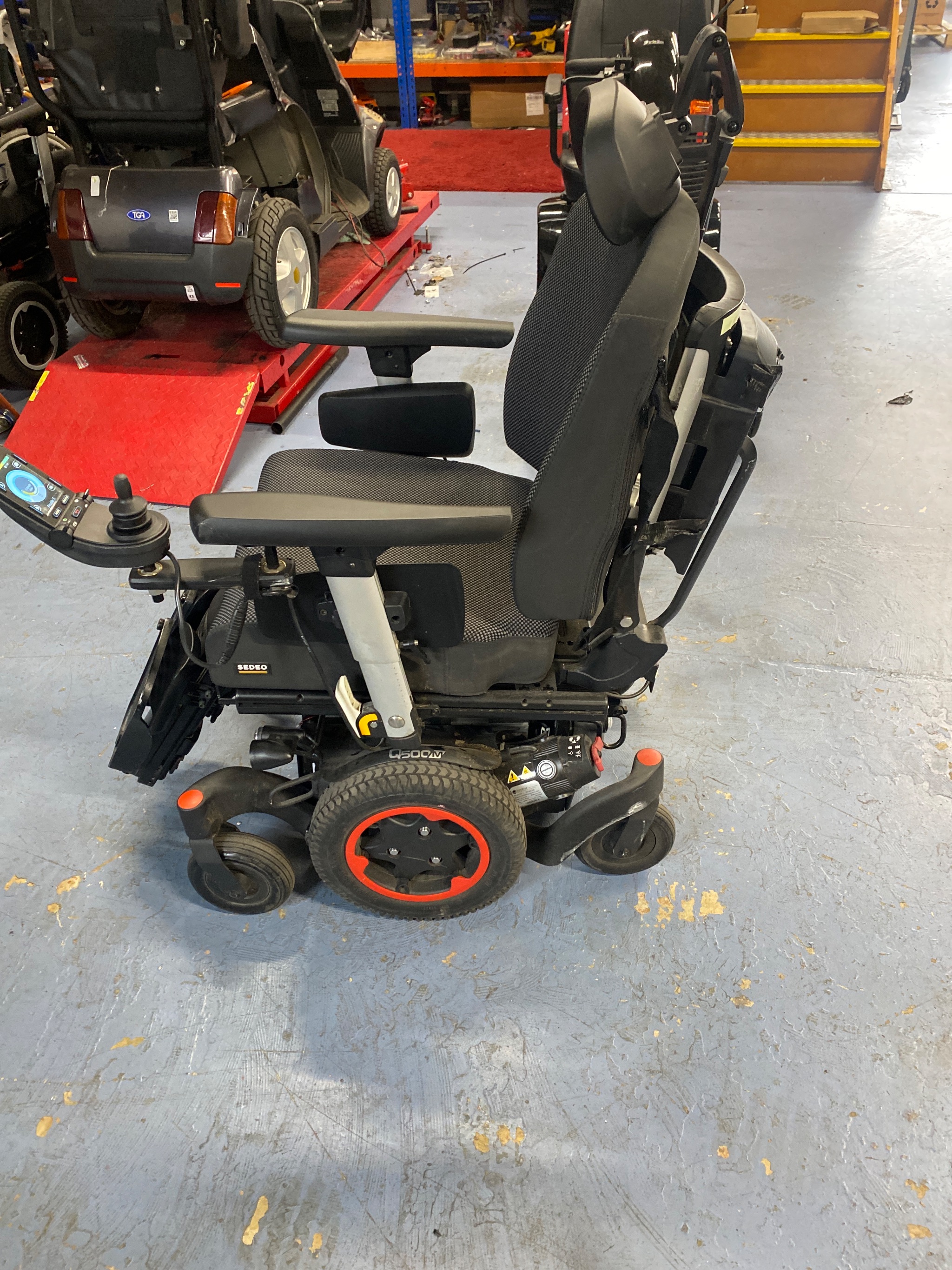 Old failed batteries removed from powerchair chassis