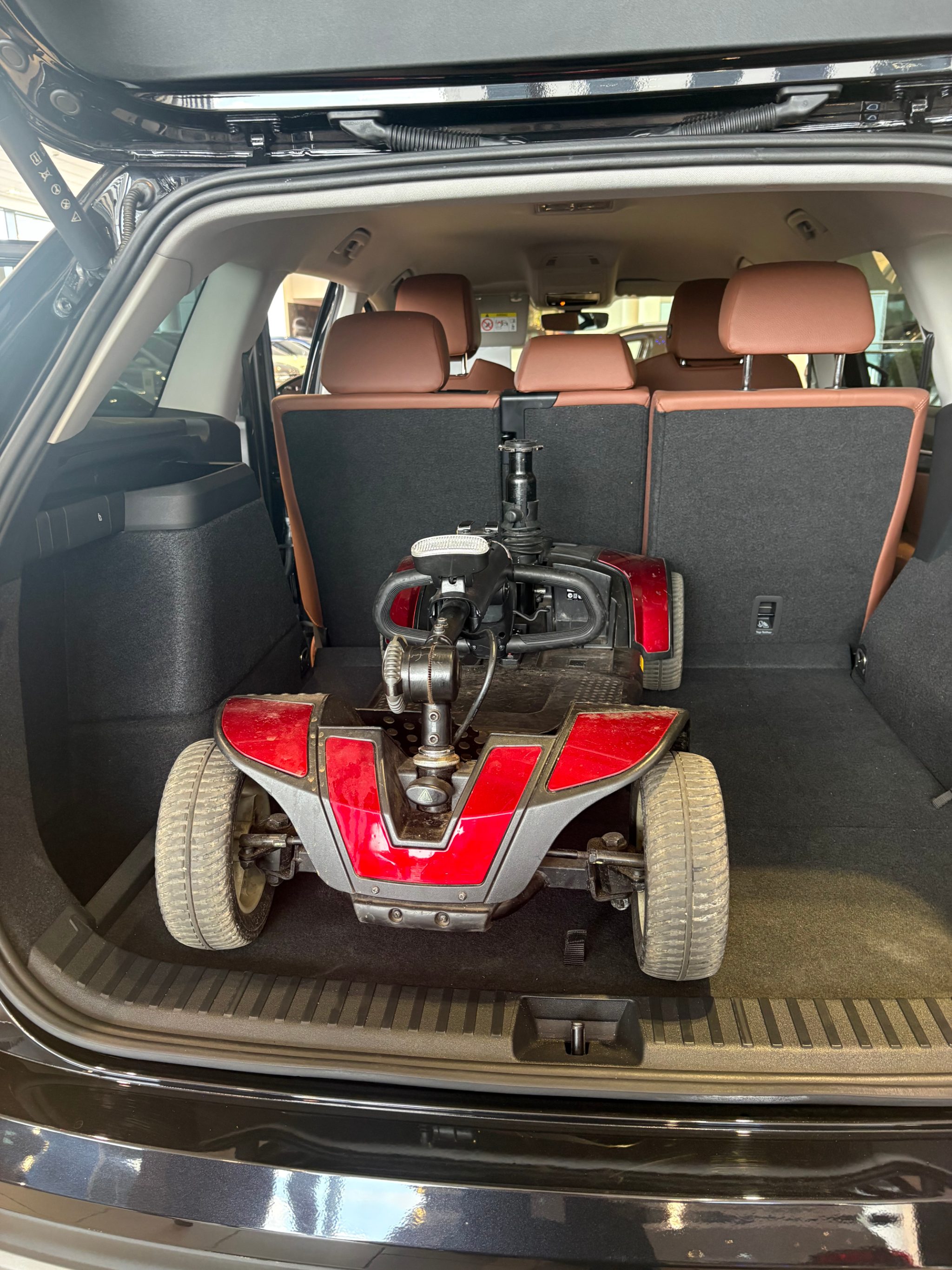 Pride GoGo Sport scooter loaded into the luggage compartment