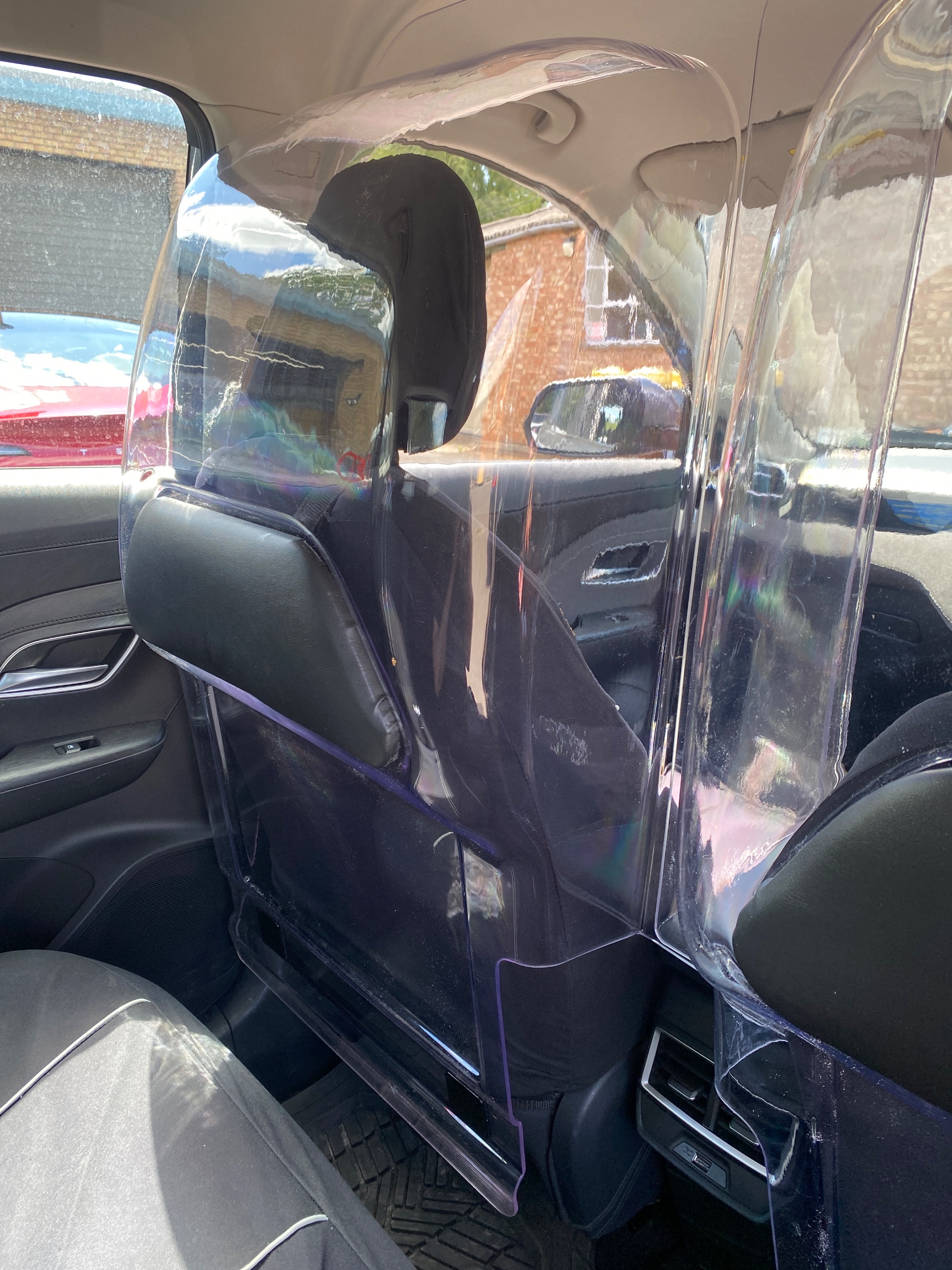 Side profile of the clear driver protection shield inside the vehicle
