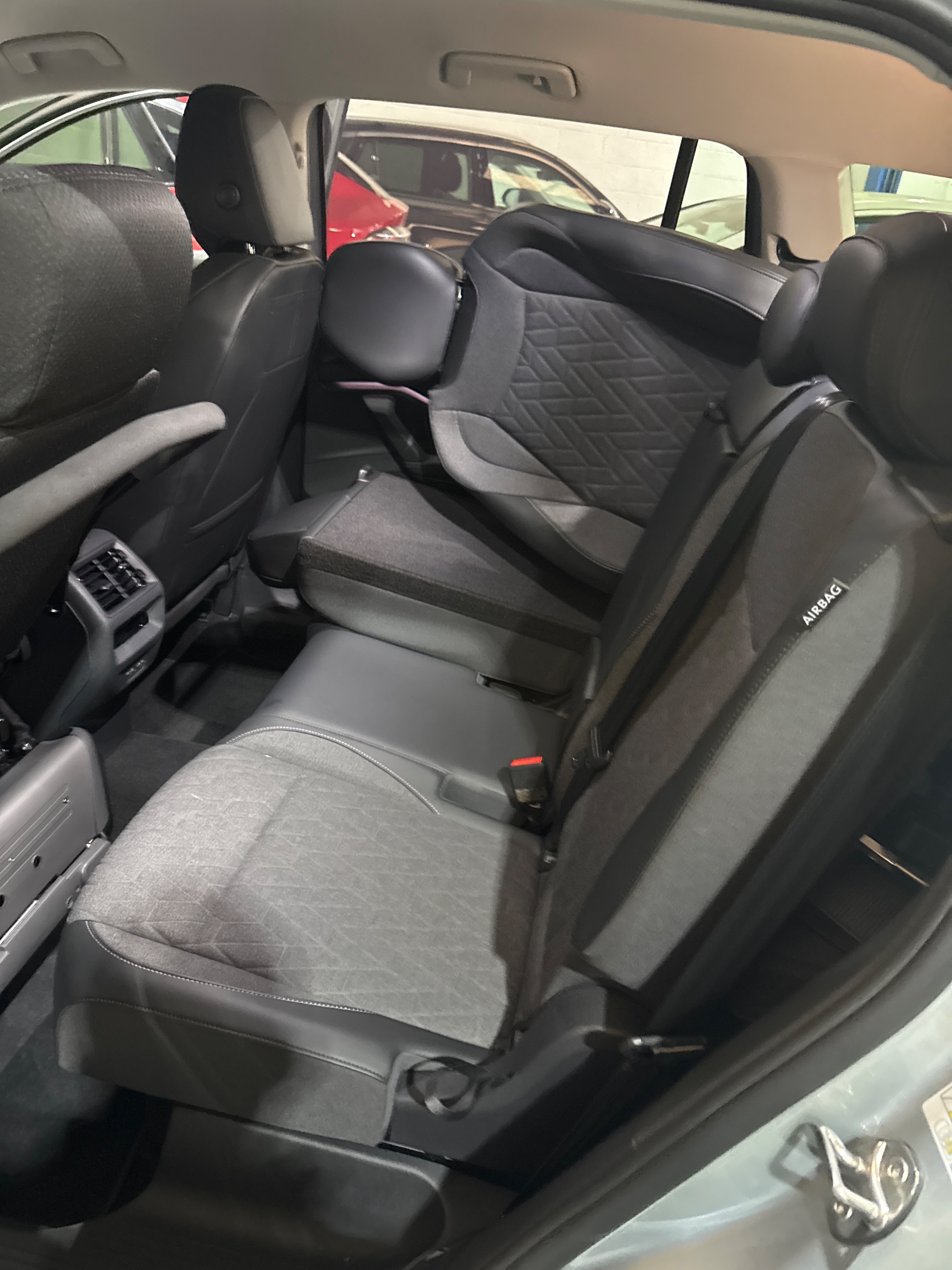 Close up of dual armrests fitted to the compact swivel seat