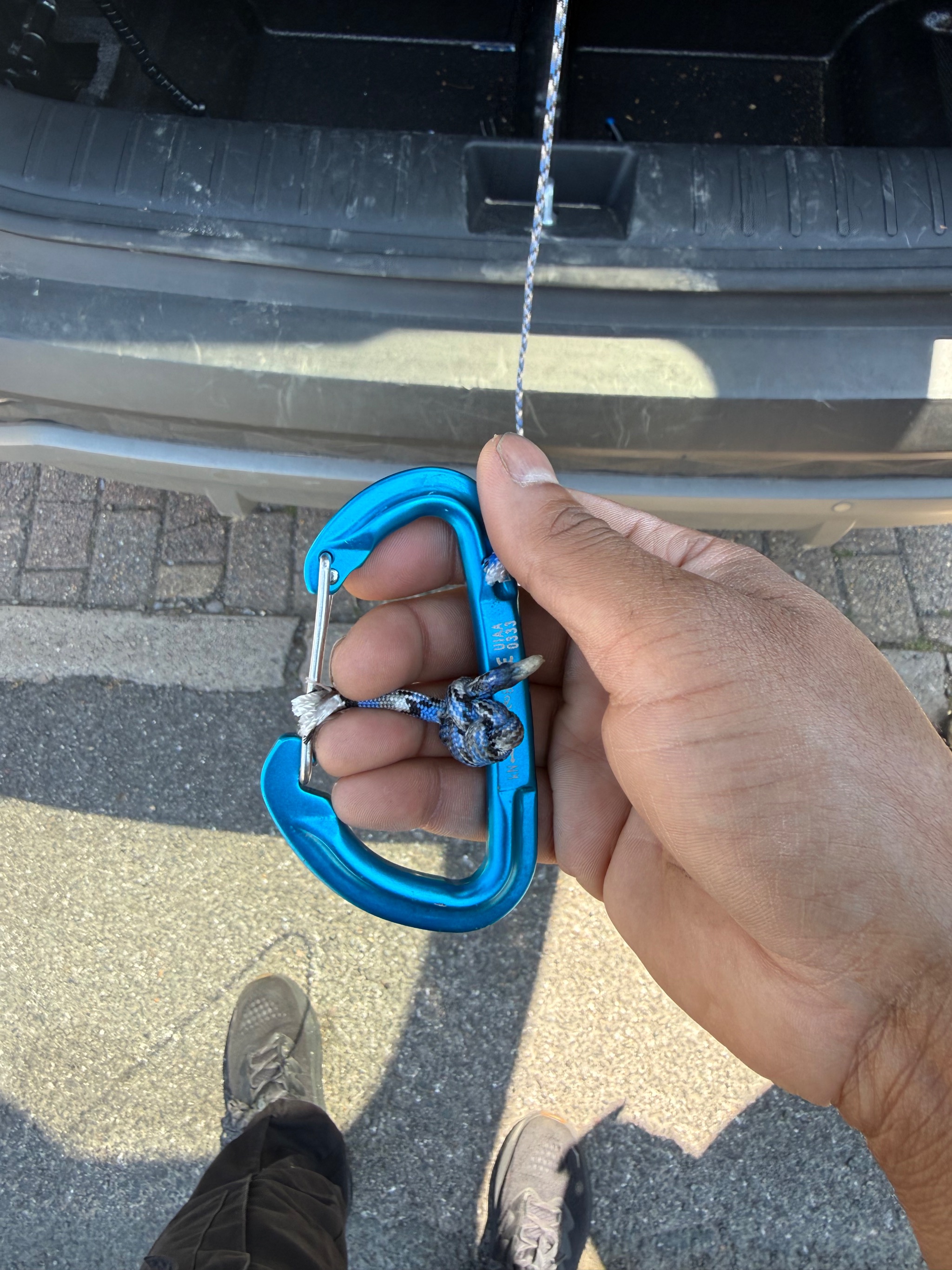 Inspecting a jammed boot hoist mechanism in a car boot