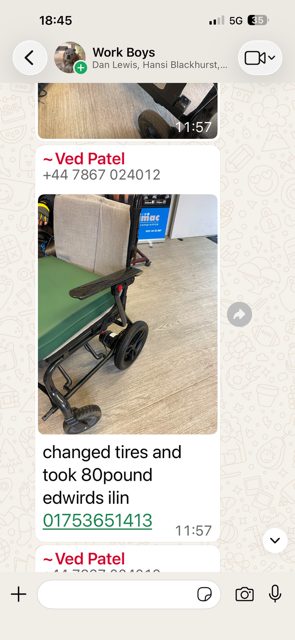 Technician inspecting equipment at Ferndown workshop