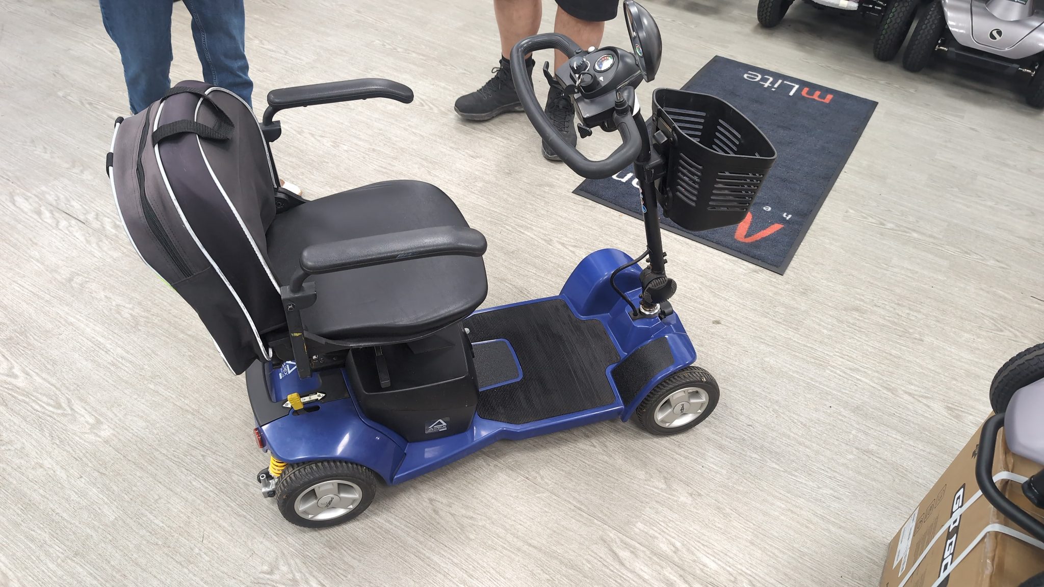 Compact folding mobility scooter prepared for rental collection at our Heathrow workshop