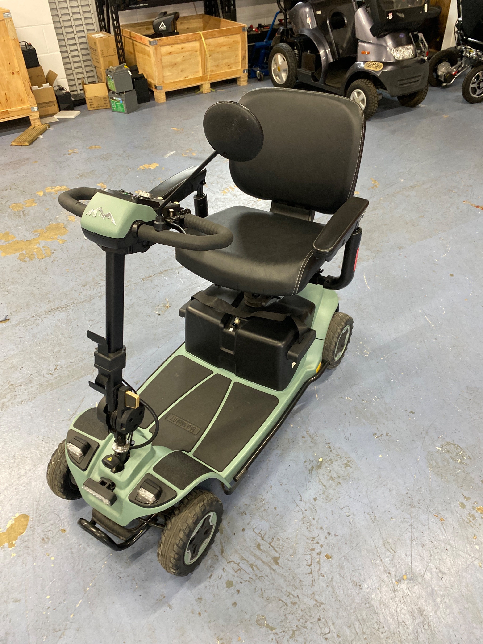 Pride Mobility scooter undergoing battery and safety inspection