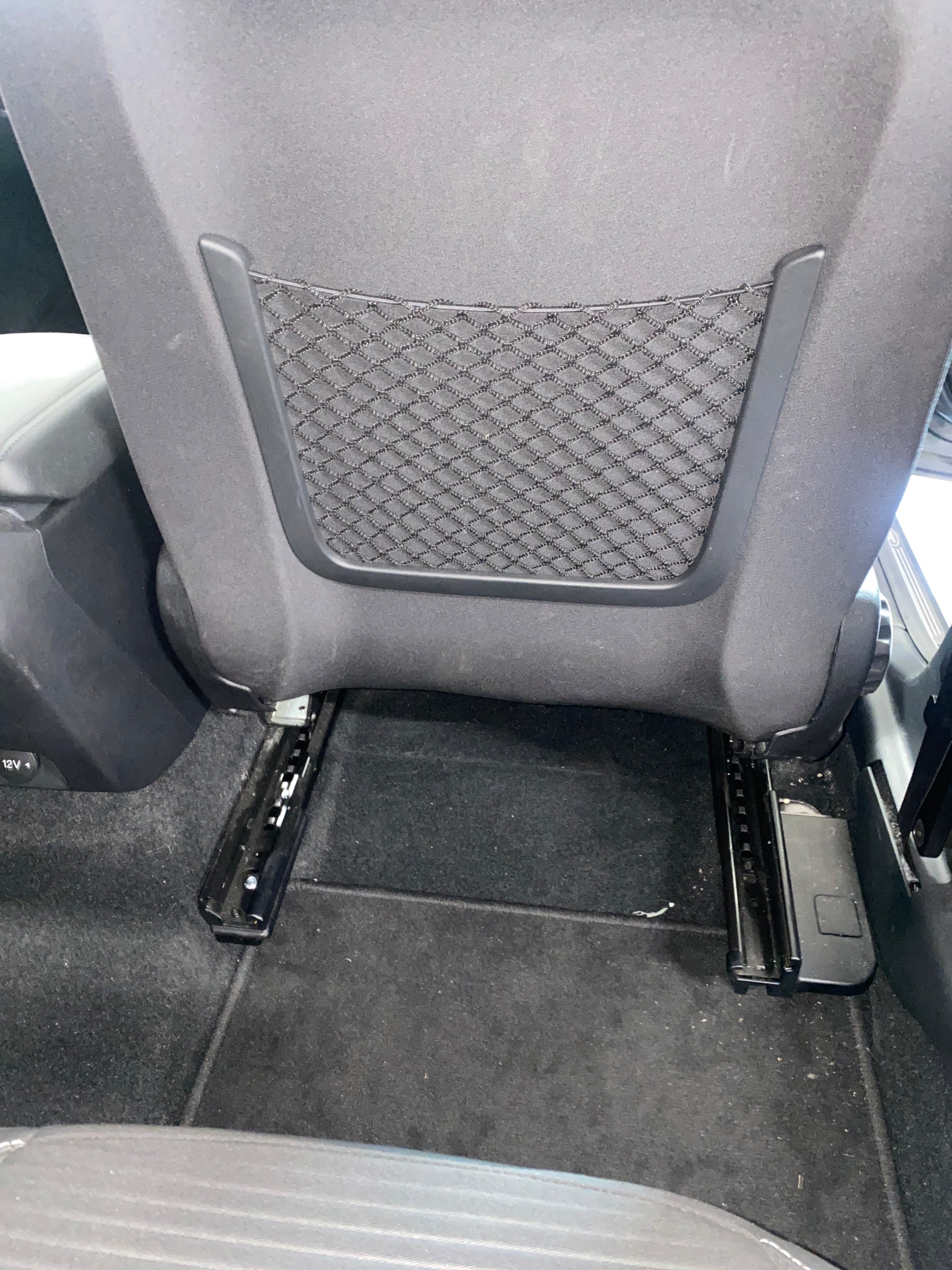Manual transfer plate in the extended position beside the driver's seat