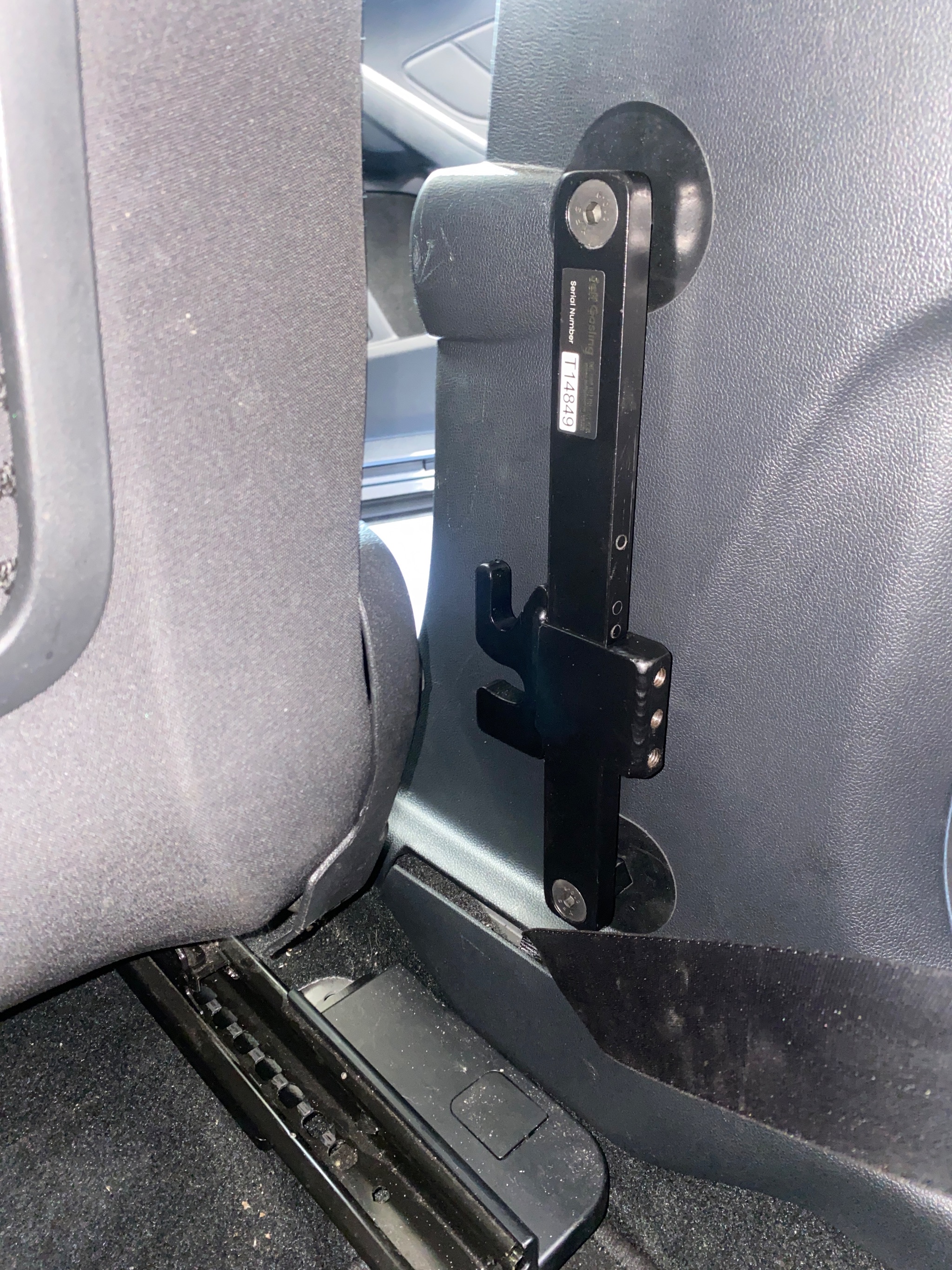 Extended seat runners installed on the driver's seat of a Ford Focus