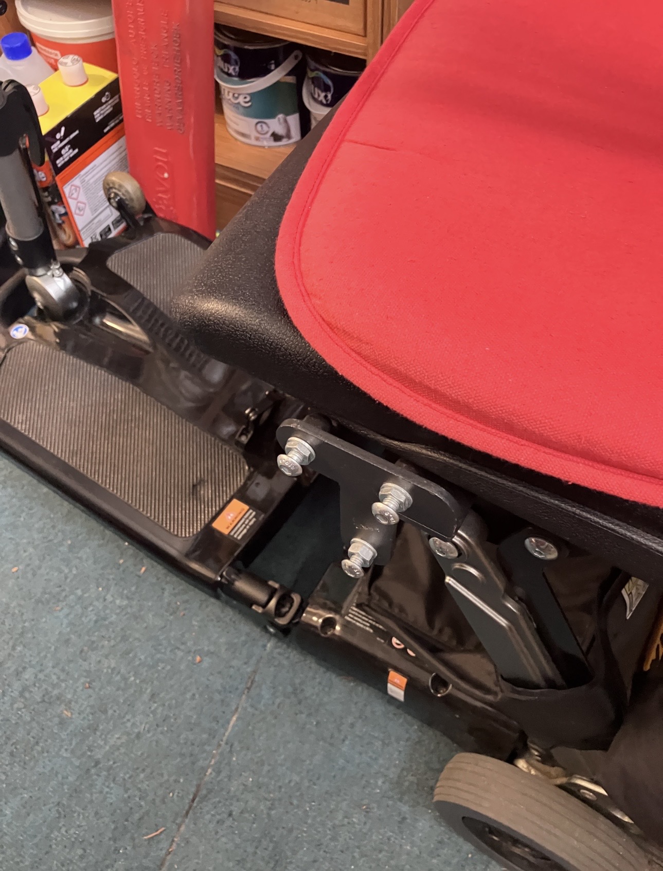 Folding mobility scooter with newly fitted lifting hoist brackets