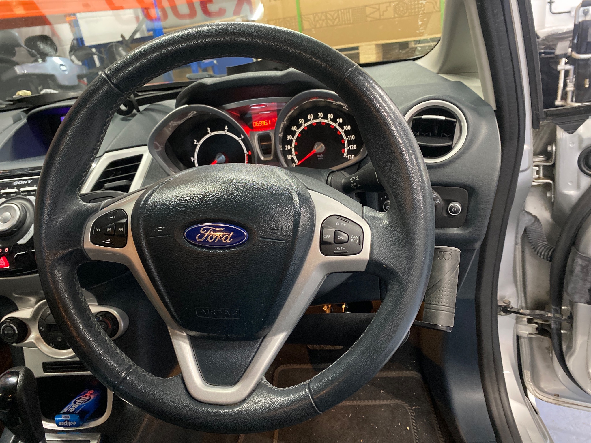 Technician carrying out final safety checks on a Ford Fiesta