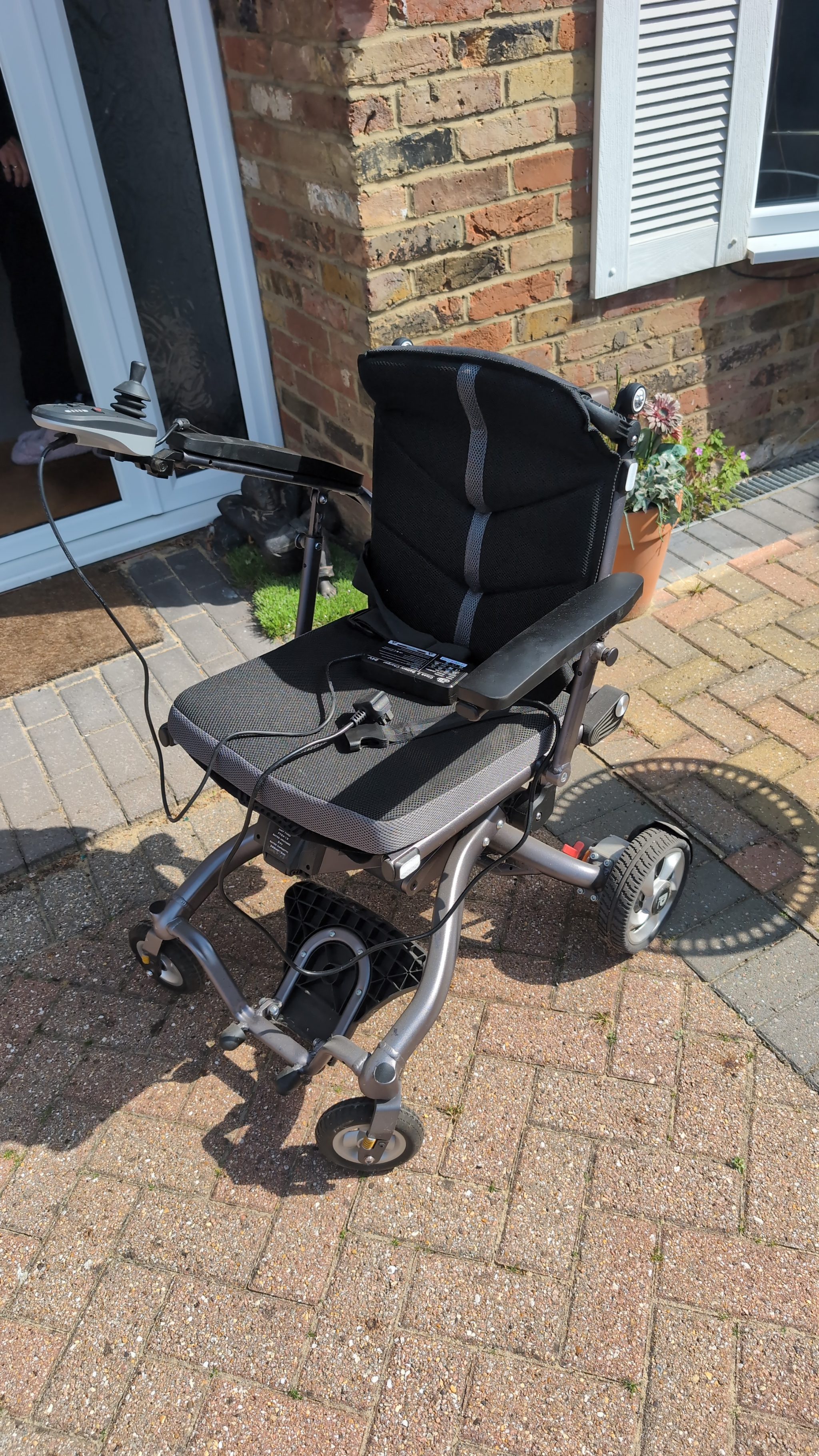 Engineer servicing an electric wheelchair