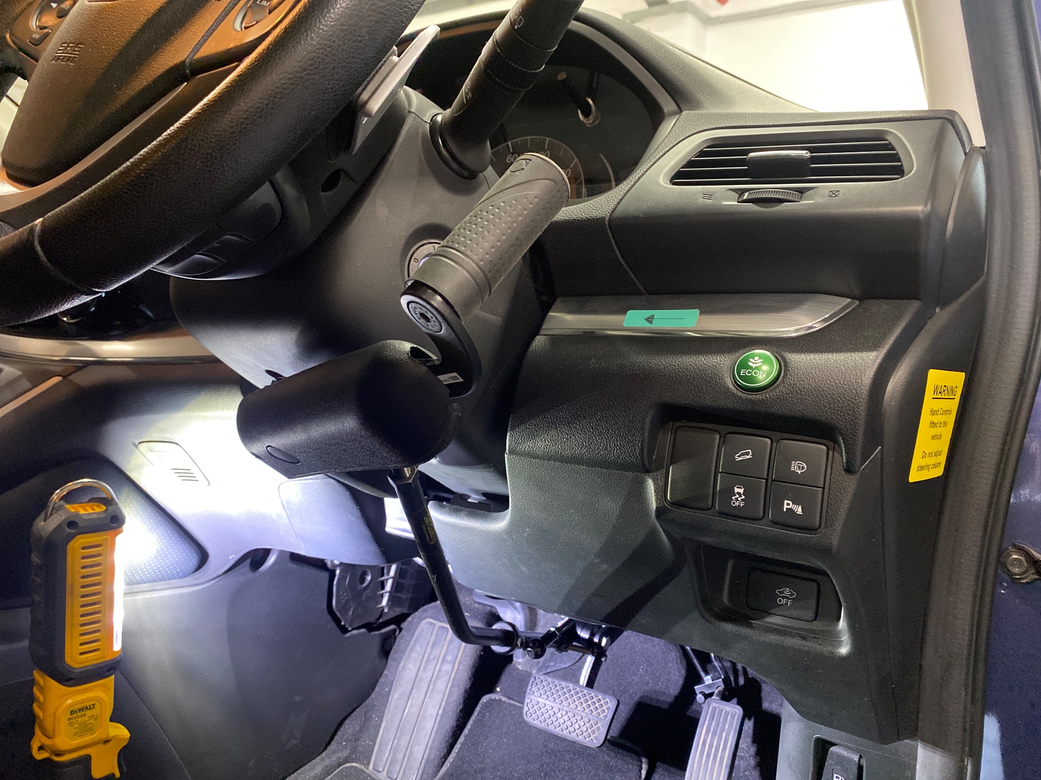 Technician inspecting the vehicle interior during adaptation fitting