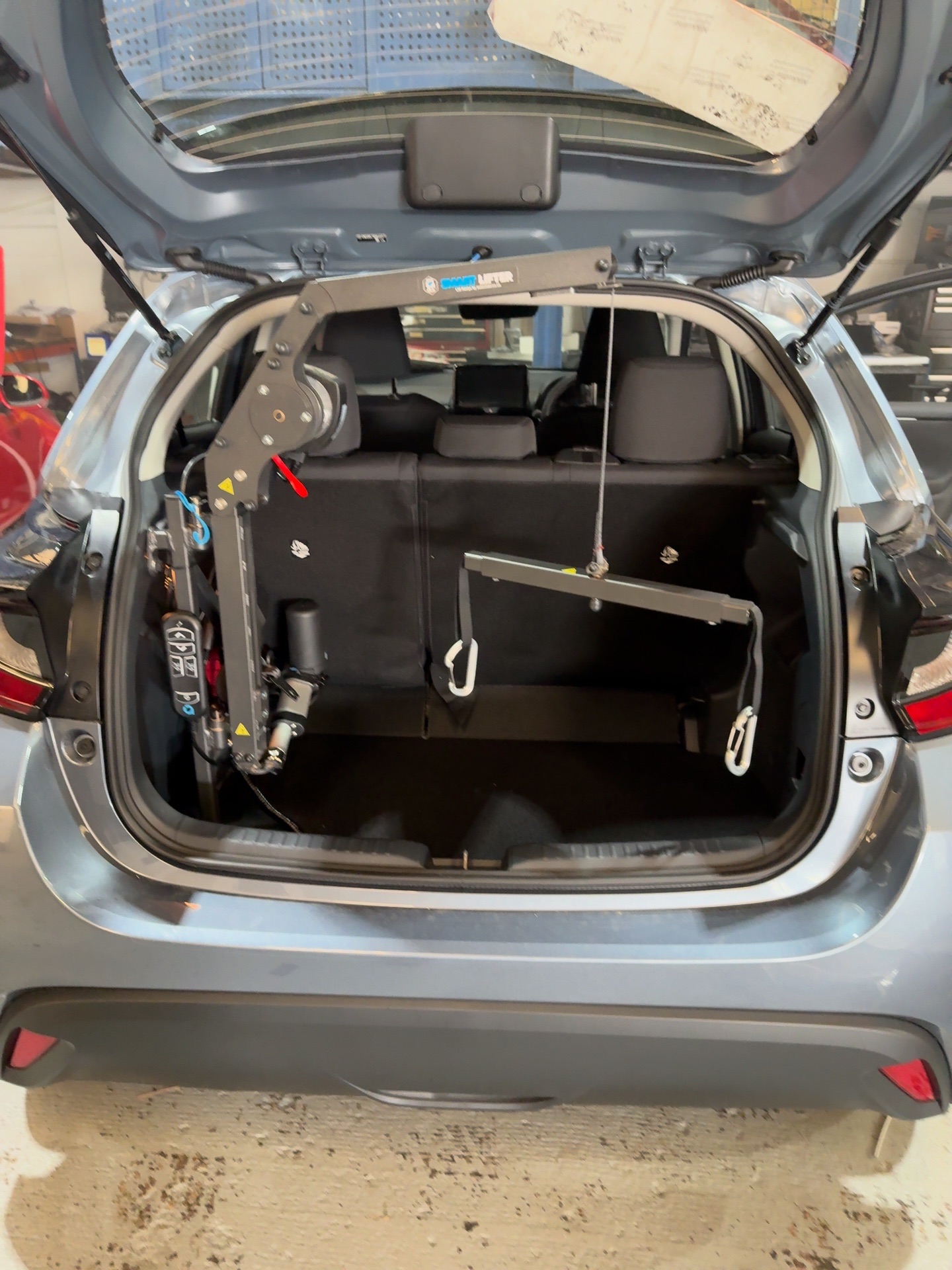 Autochair 40kg mini boot hoist fitted in Toyota Yaris hatchback boot