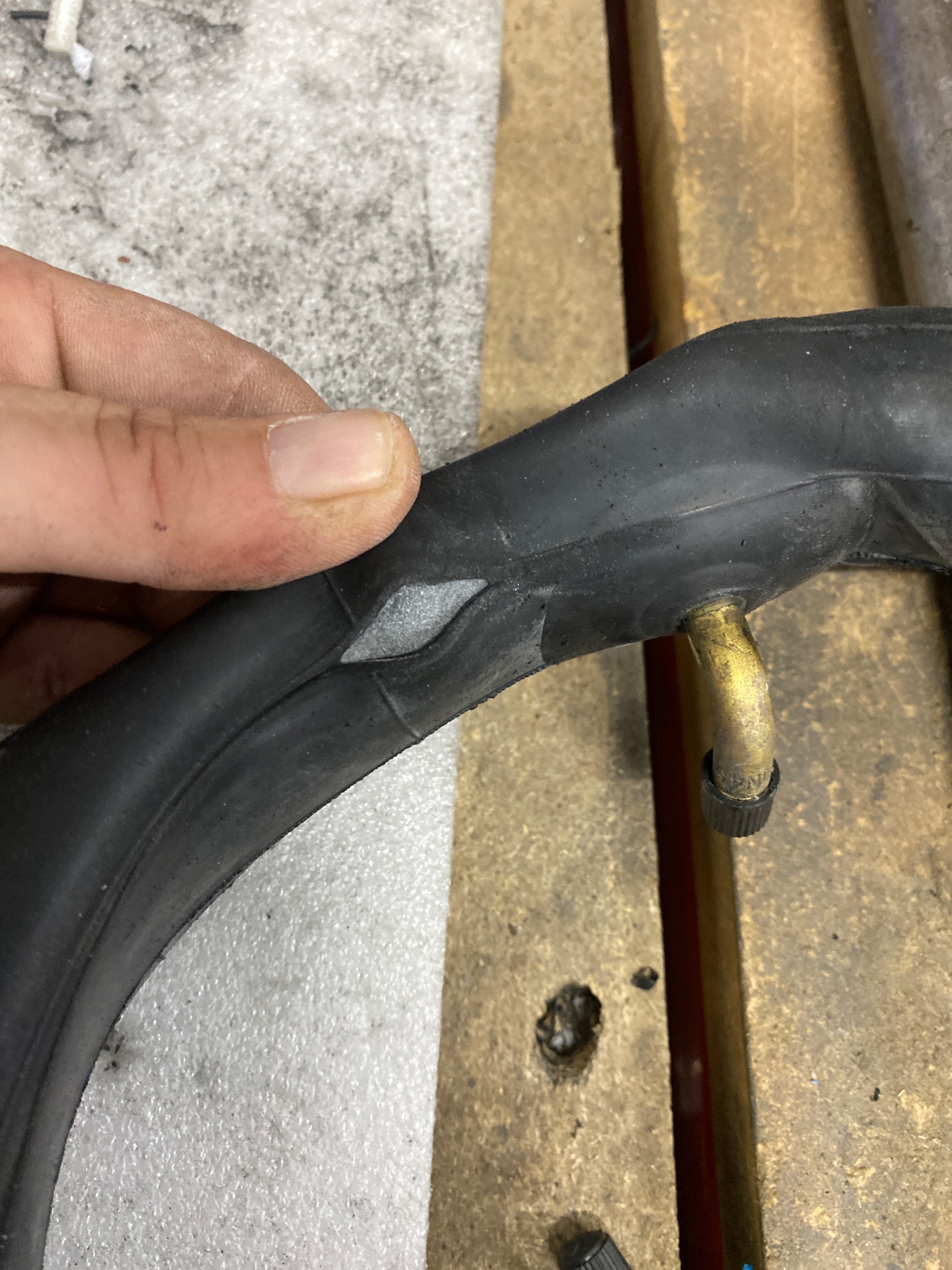 Reassembled mobility scooter tyre checked for correct pressure