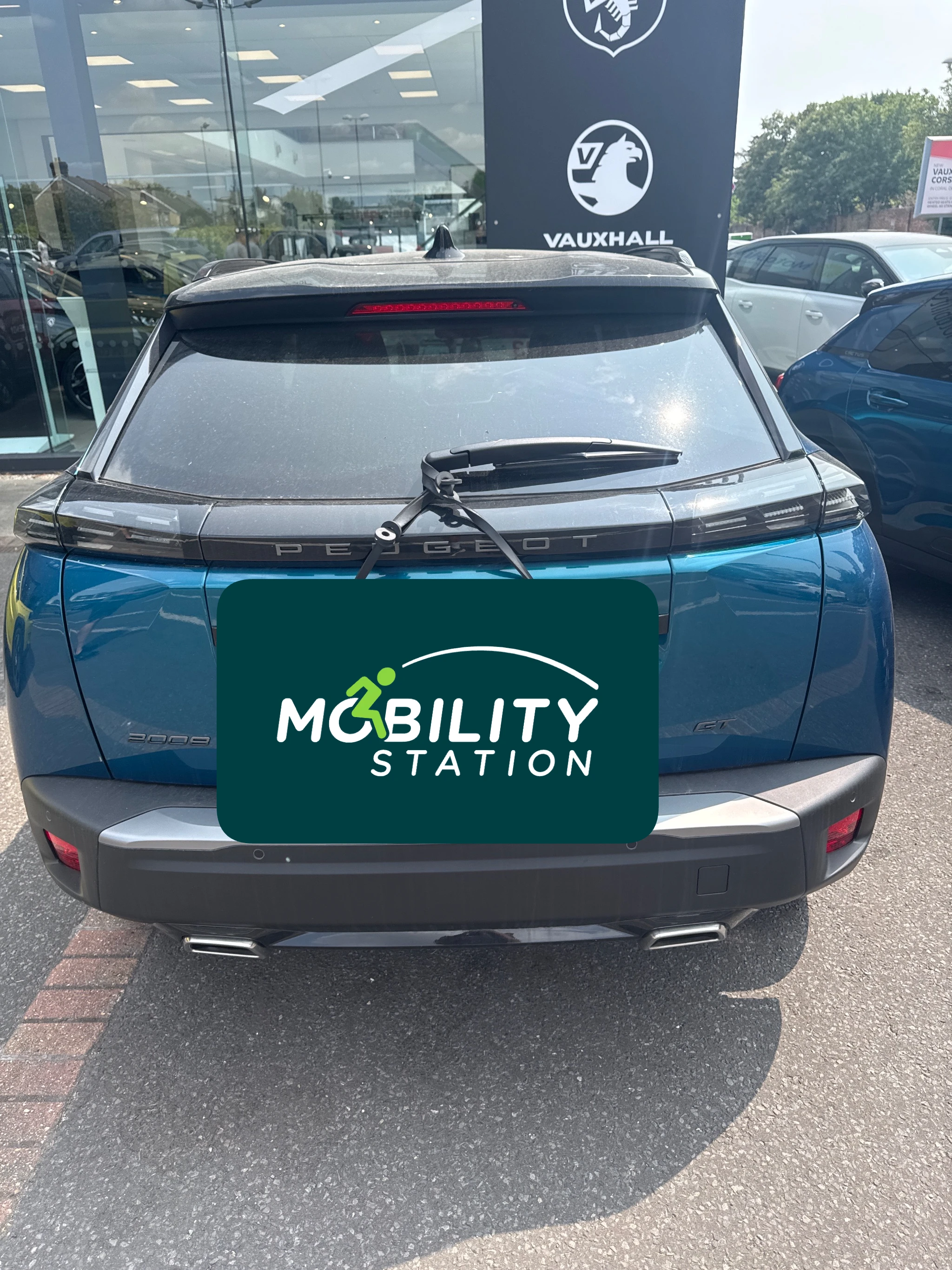 Autochair Smart Transfer person hoist installed in a Peugeot 2008
