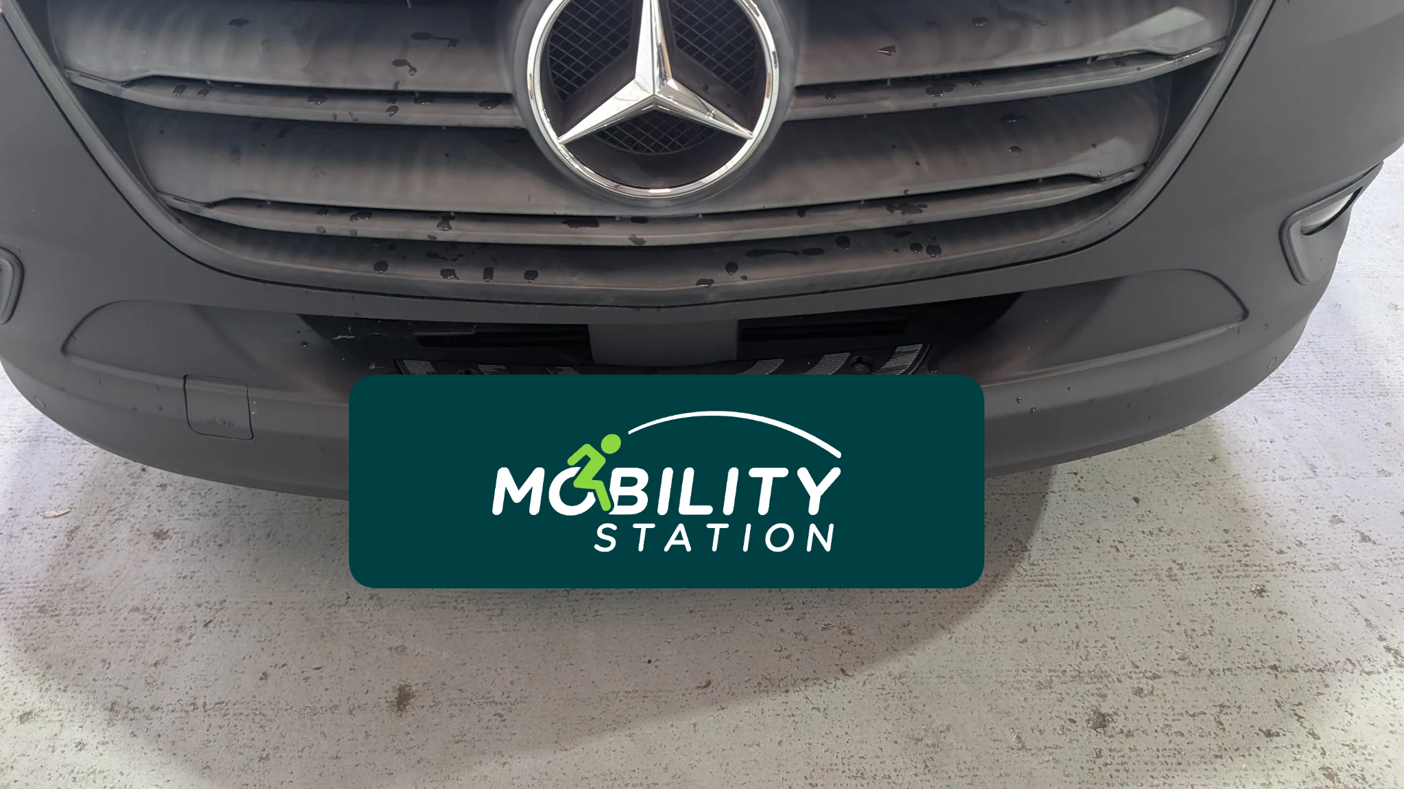 Technician removing damaged side step mechanism
